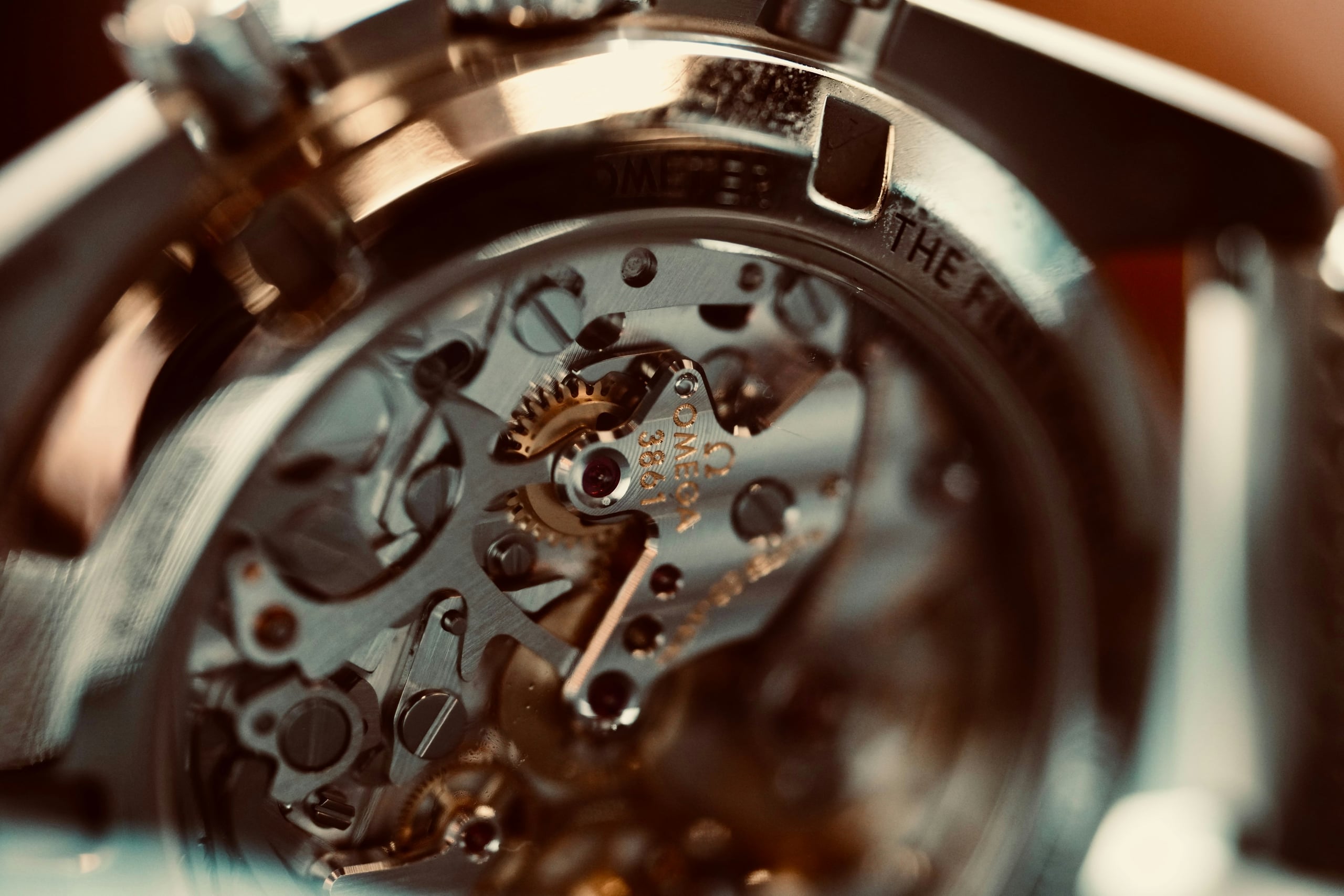A skeletonised automatic movement seen through a sapphire caseback