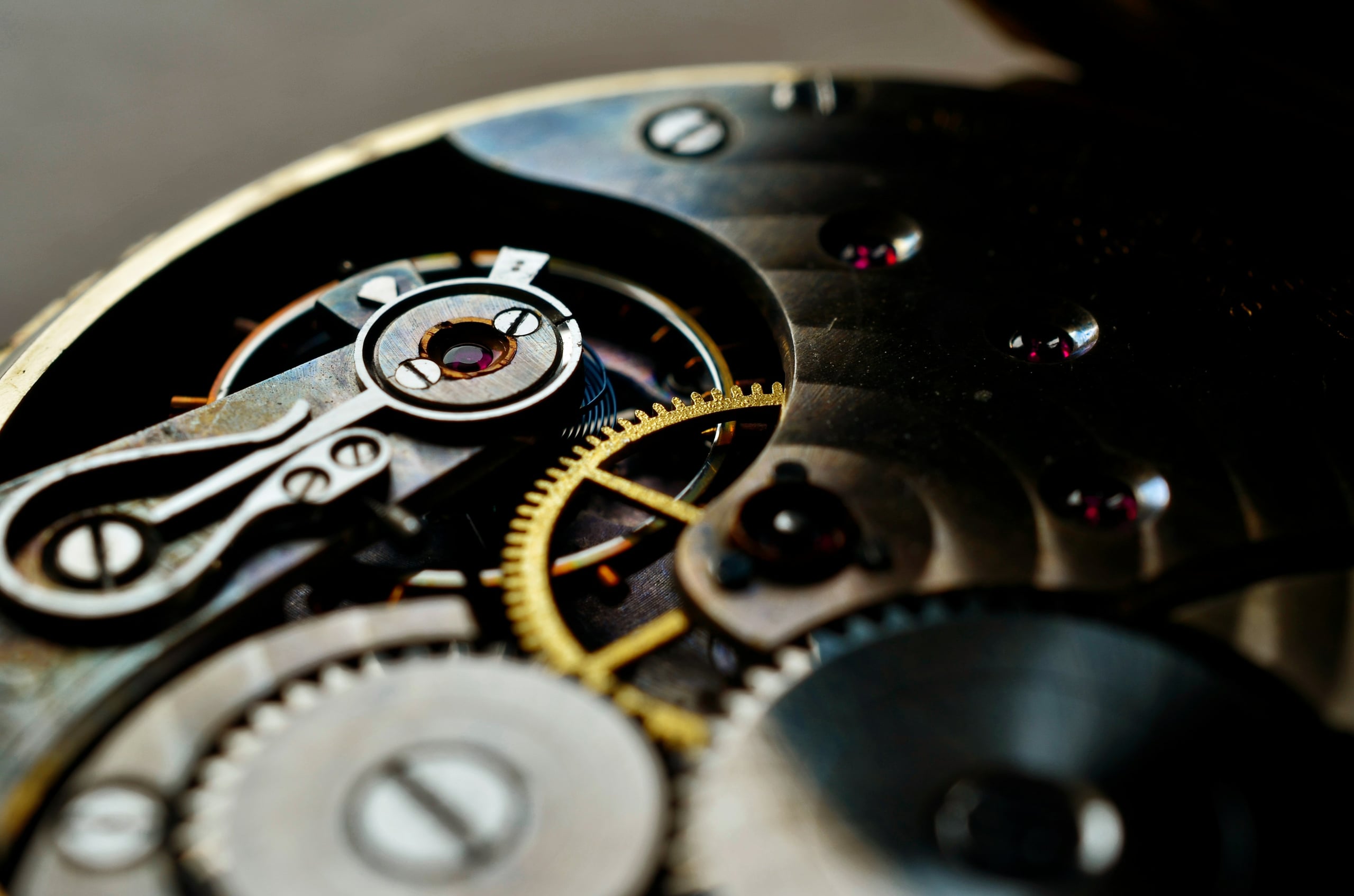 Gear train, ruby jewels and balance cock of a mechanical movement